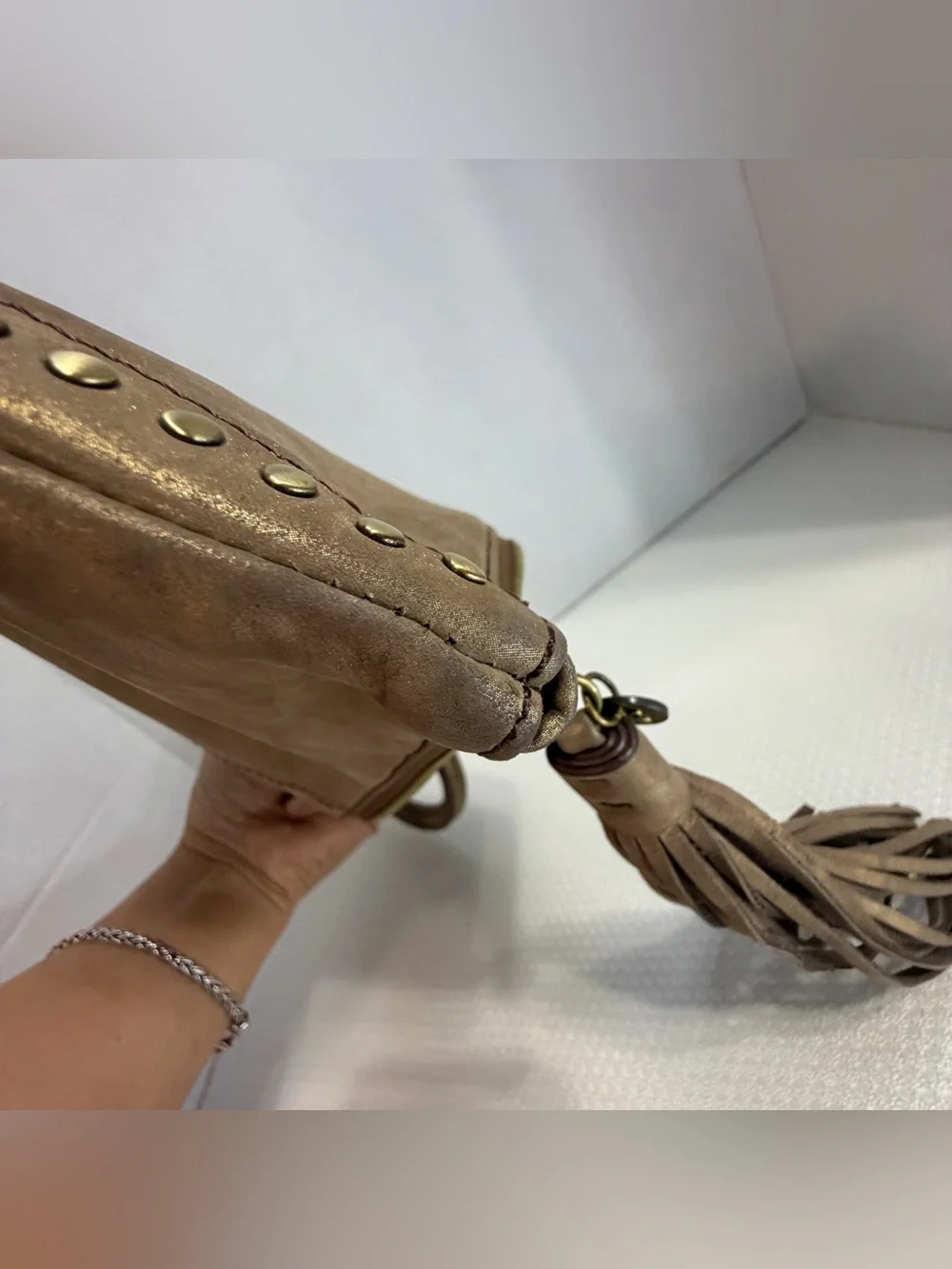 HOBO Metallic Bronze Studded Wristlet Tote with Tassel